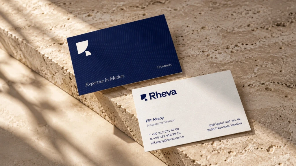 Business cards on ivory and navy stock.