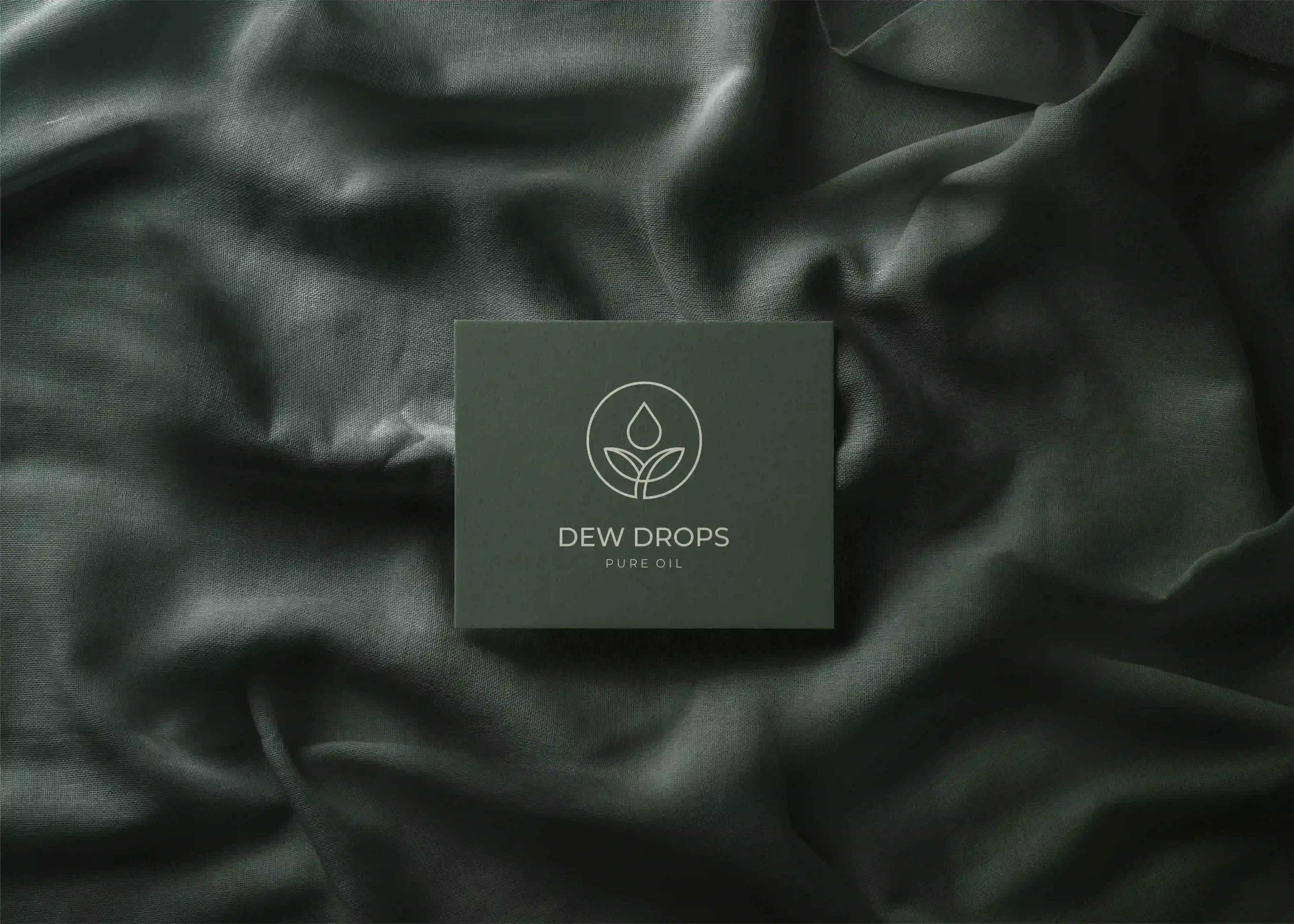 Dew Drops box with the logo on dark green silk