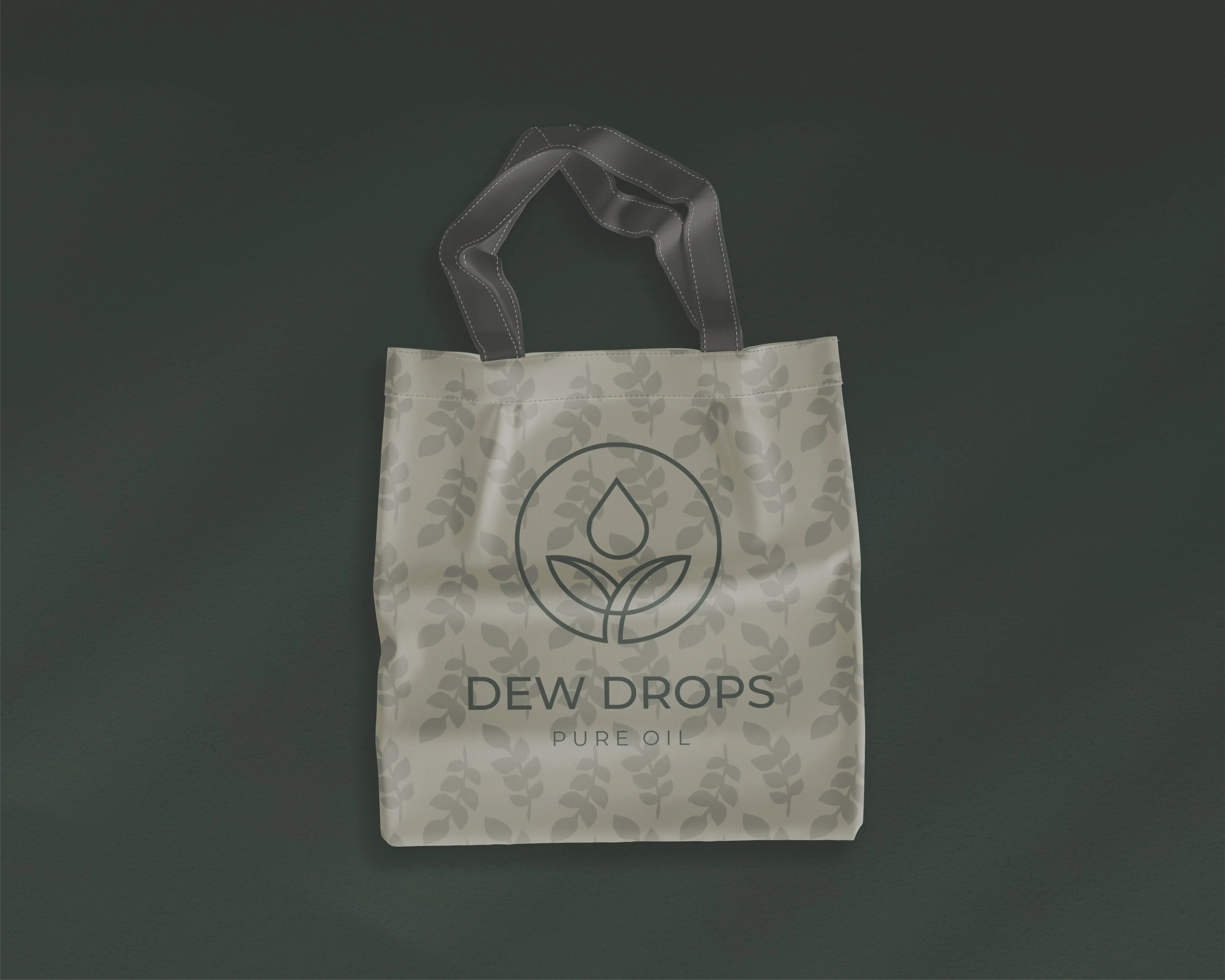 Dew Drops tote bag with the logo and leaf pattern on dark green